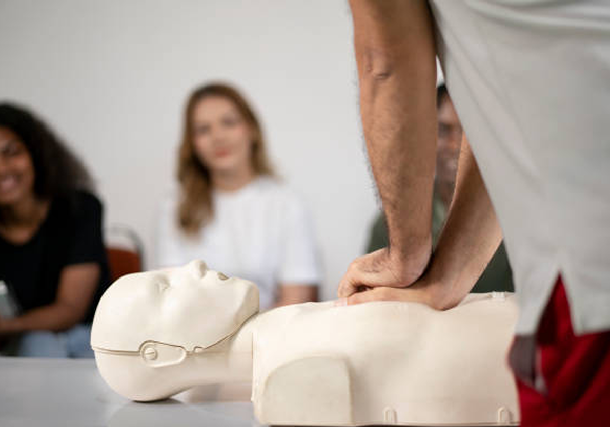 CPR training session with a mannequin.