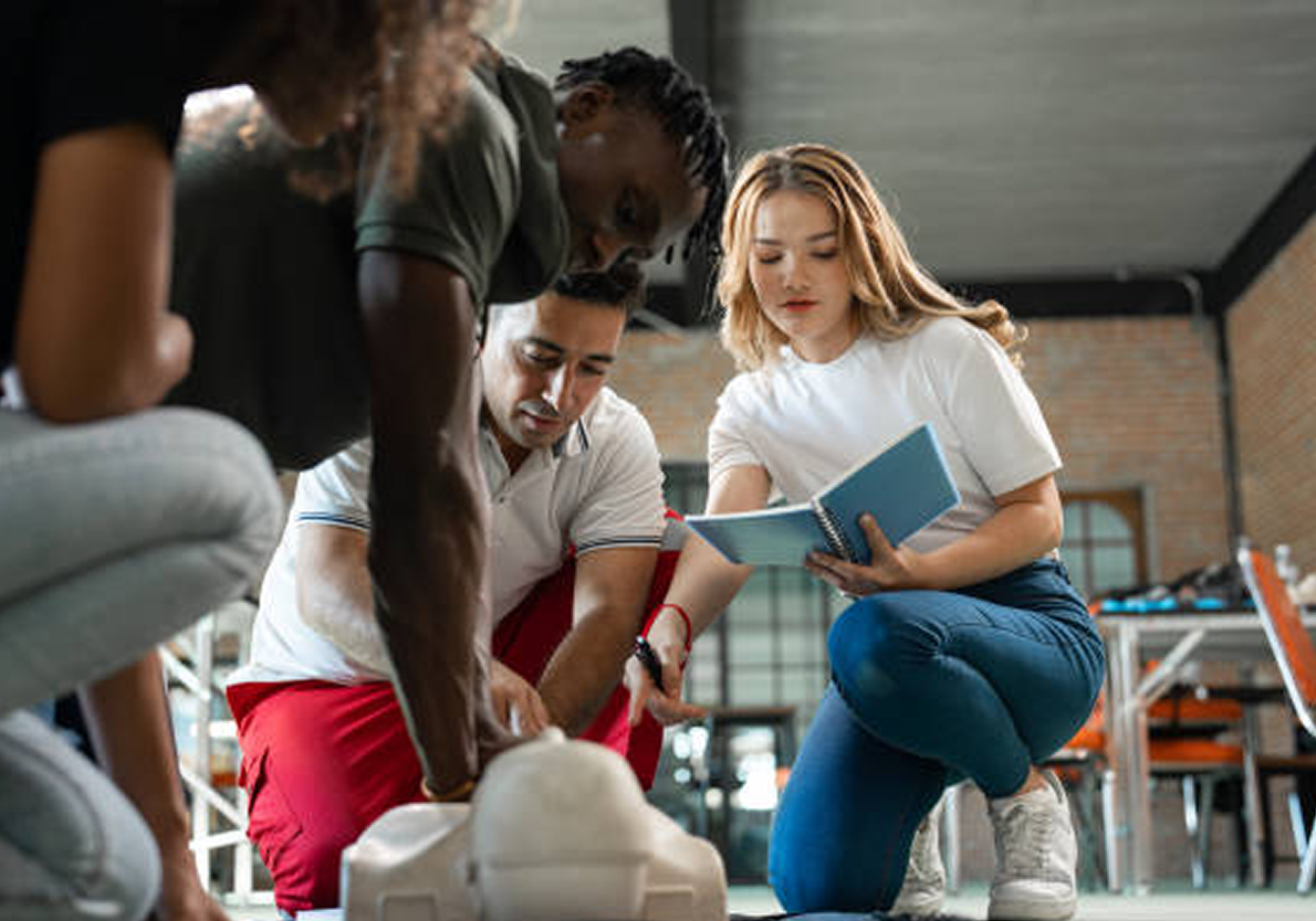 CPR training with diverse group and instructor.